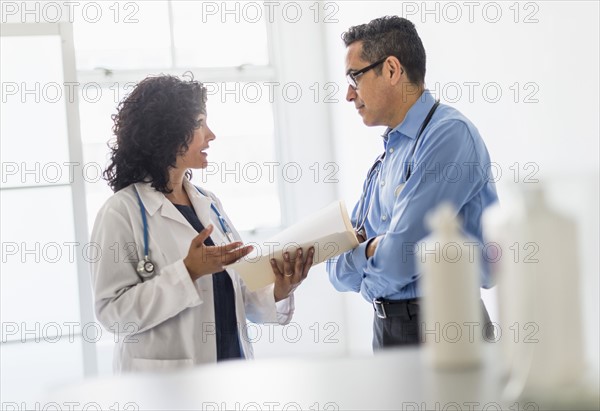 Female and male doctors working together.