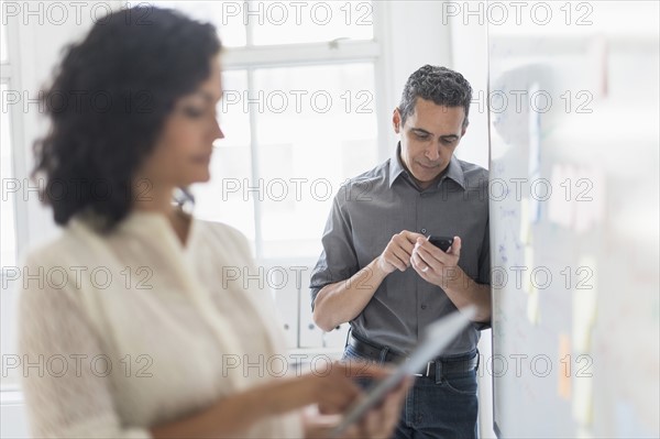 Man and woman working in office.