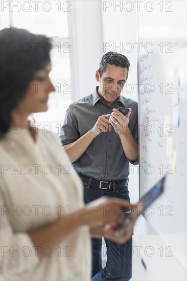 Man and woman working in office.