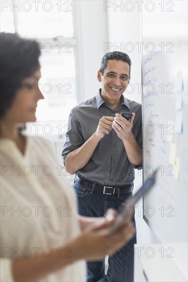 Man and woman working in office.