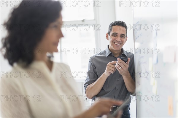 Man and woman working in office.