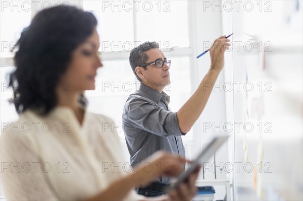 Man and woman working in office.