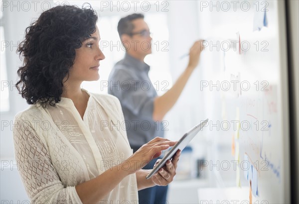 Man and woman working in office.