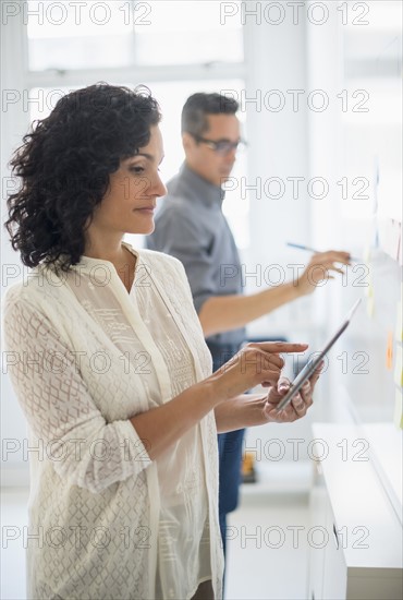 Man and woman working in office.