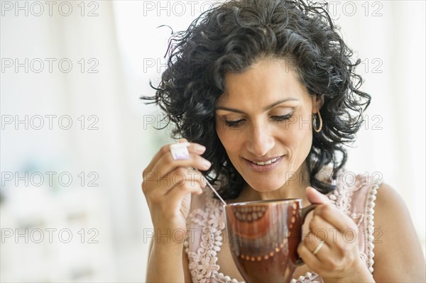 Woman enjoying her tea.