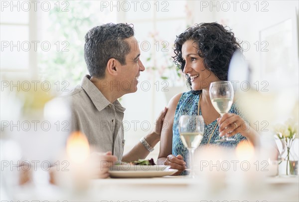 Couple dining in restaurant.