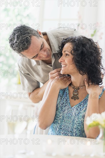 Couple celebrating anniversary in restaurant.