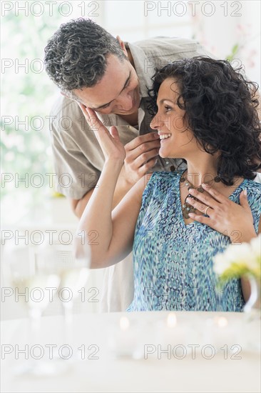 Couple celebrating anniversary in restaurant.