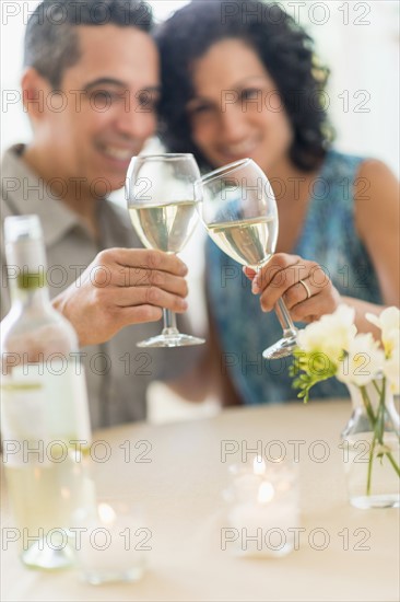 Couple celebrating anniversary in restaurant.