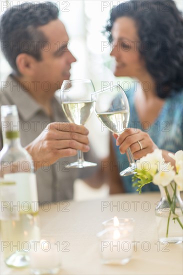 Couple celebrating anniversary in restaurant.