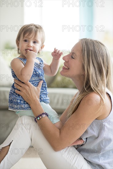 Mother with baby daughter (18-23 months).