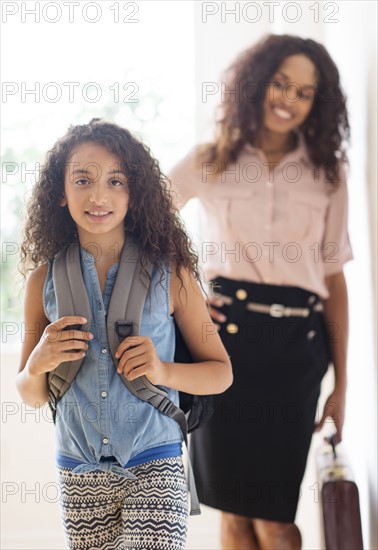 Daughter (8-9) and mother going to school.