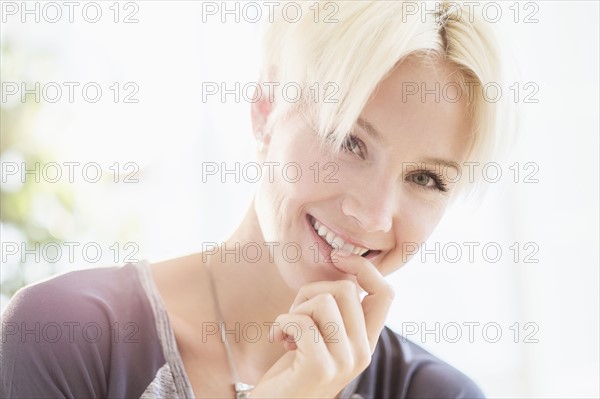 Portrait of blonde woman smiling.