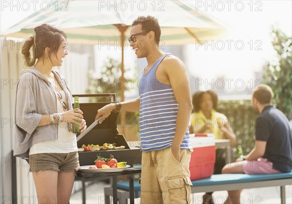 Group of friends enjoying barbeque.