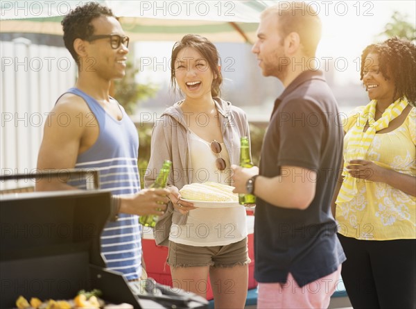 Group of friends enjoying barbeque.