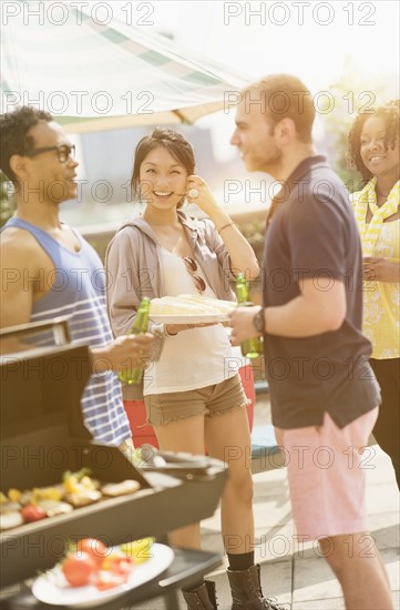 Group of friends enjoying barbeque.