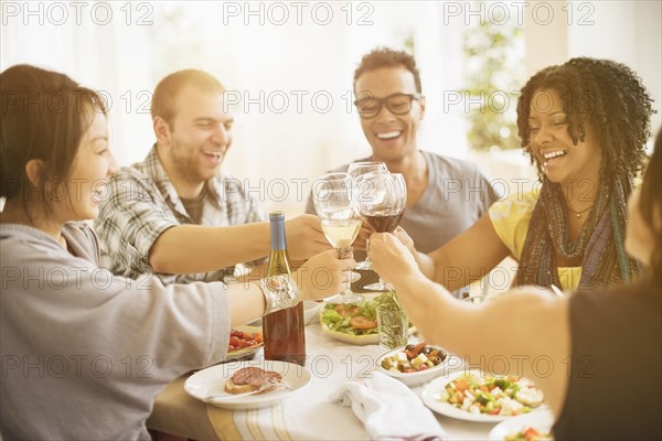 Group of friends enjoying dinner party.