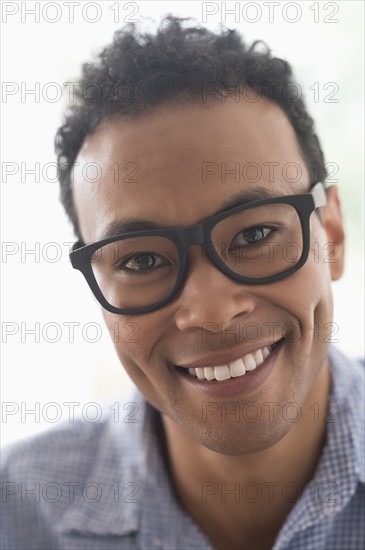 Portrait of young man smiling.