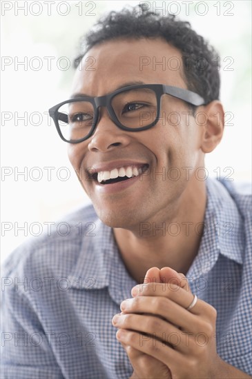 Portrait of young man smiling.