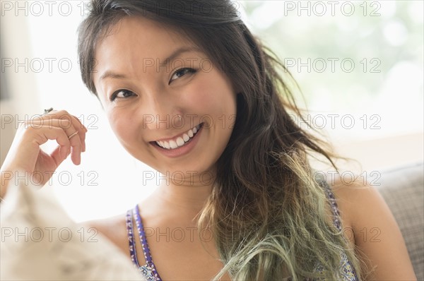 Portrait of young woman smiling.