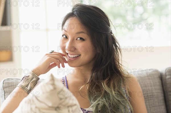 Portrait of young woman smiling.