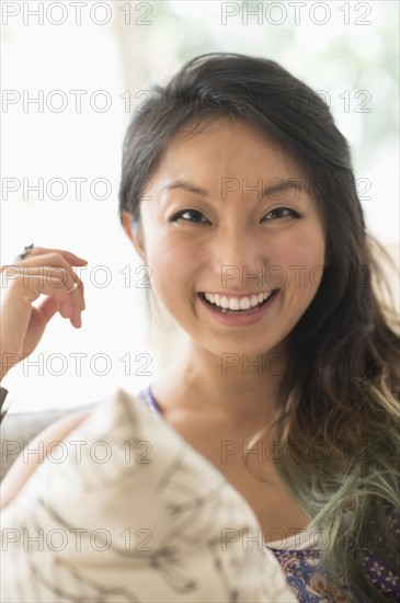Portrait of young woman smiling.