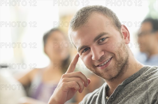 Portrait of young man smiling.