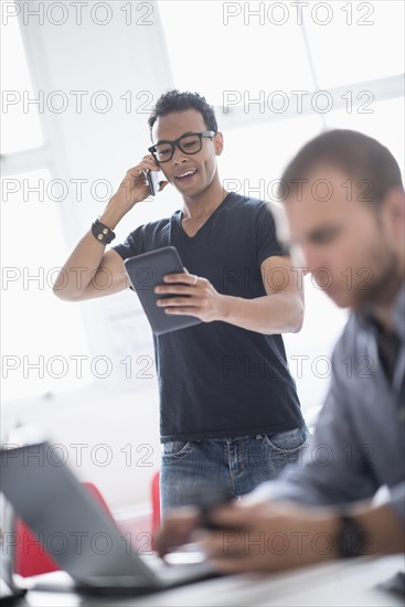 Men working in office.