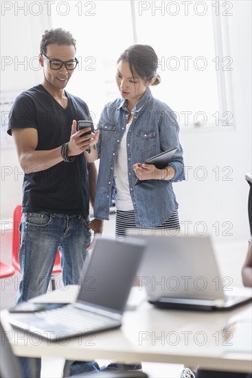 Woman and man in office.