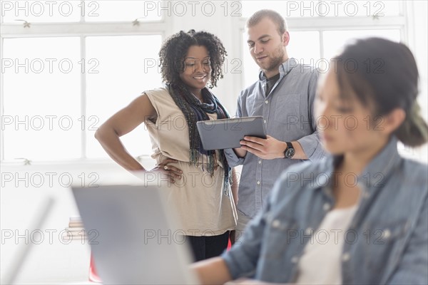 Man and women working in office.