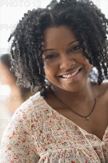 Portrait of smiling woman.