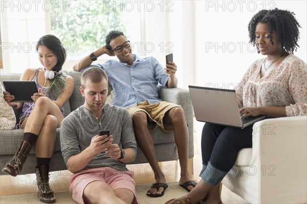 Friends hanging out in living room.