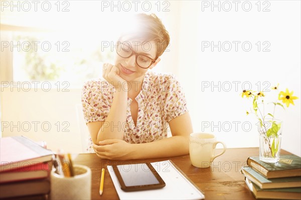 Young woman working in home office.