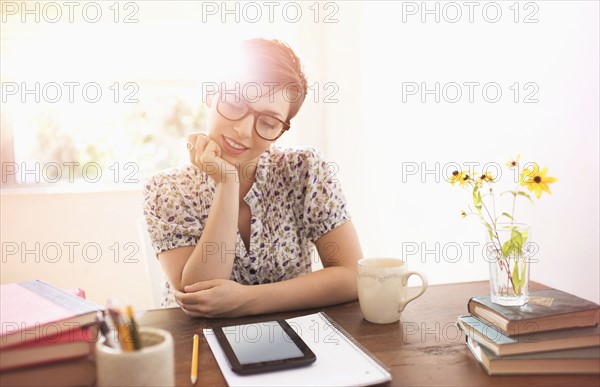 Young woman working in home office.