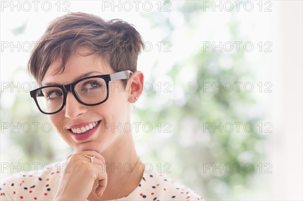 Portrait of smiling woman wearing eyeglasses.