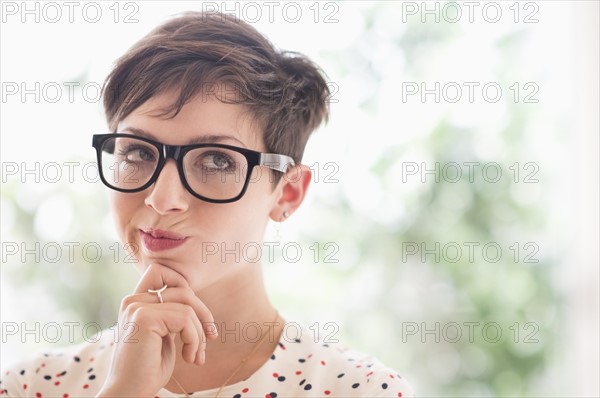 Portrait of smiling woman wearing eyeglasses.