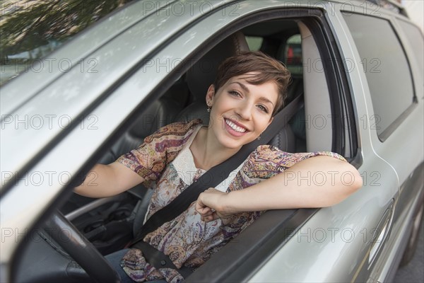 Portrait of woman in car.