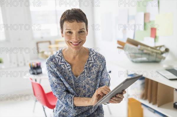 Portrait of woman working in home office.