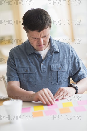 Man with down syndrome playing memory game.