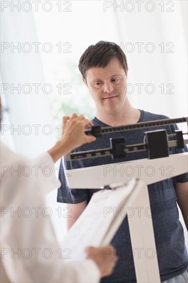 Man with down syndrome in doctors office.