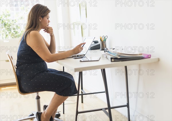 Woman working in home office.