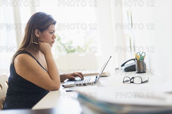 Woman working in home office.