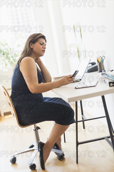 Woman working in home office.