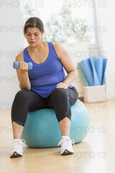 Woman exercising at gym.