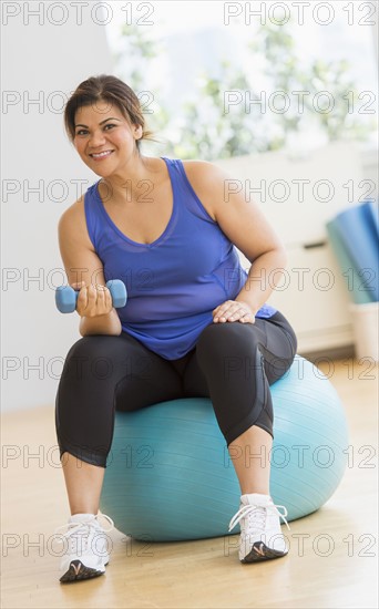 Woman exercising at gym.