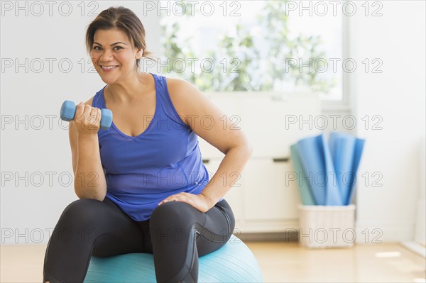 Woman exercising at gym.