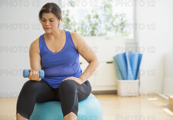 Woman exercising at gym.