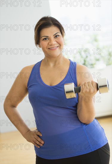 Woman exercising at gym.