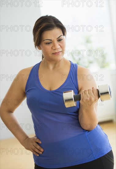 Woman exercising at gym.