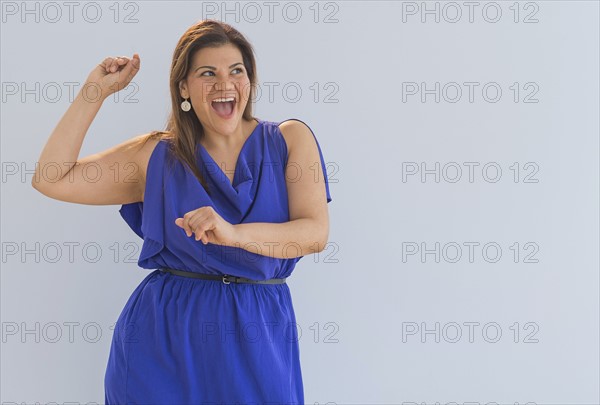 Studio shot of happy woman.